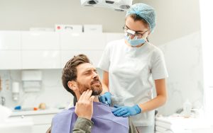 D&D Dental clinic: Patient talking to their dentist about TMJ