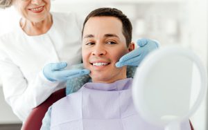 D&D Dental clinic: Patient talking to their dentist about cosmetic dentistry